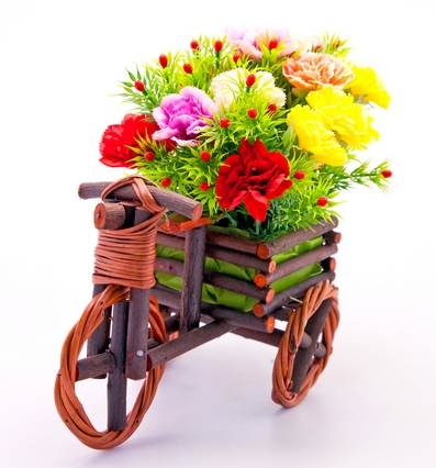Wooden tricycle with bouquet of flowers